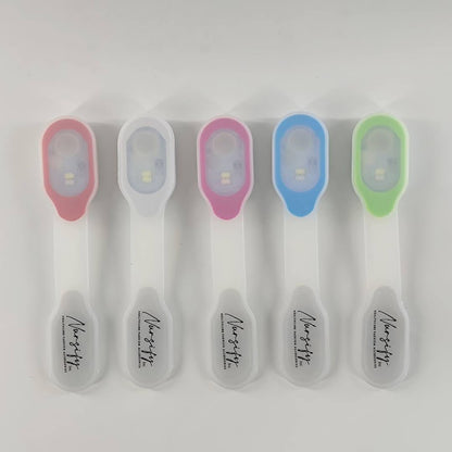 Five magnetic clip-on scrub flashlights in white, blue, red, purple and green