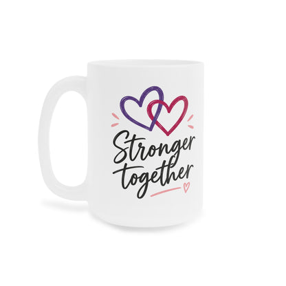 White 15oz ceramic mug with Stronger Together lettering and intertwined purple and raspberry hearts, opposite side view.