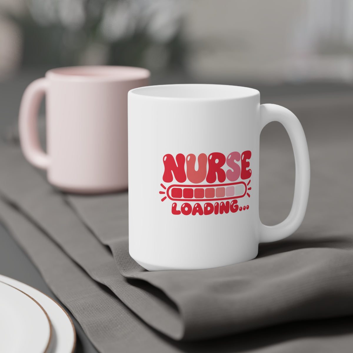 Nurse Loading Mug, Coral Progress Bar, 15 oz, styled supplier scene with centred artwork