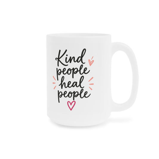 White 15oz ceramic mug with Kind People Heal People handwritten lettering and pink heart, handle on right.