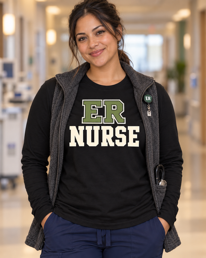 Nurse wearing a black ER Nurse long sleeve shirt under an open black nursing jacket, with the centred lettering visible.