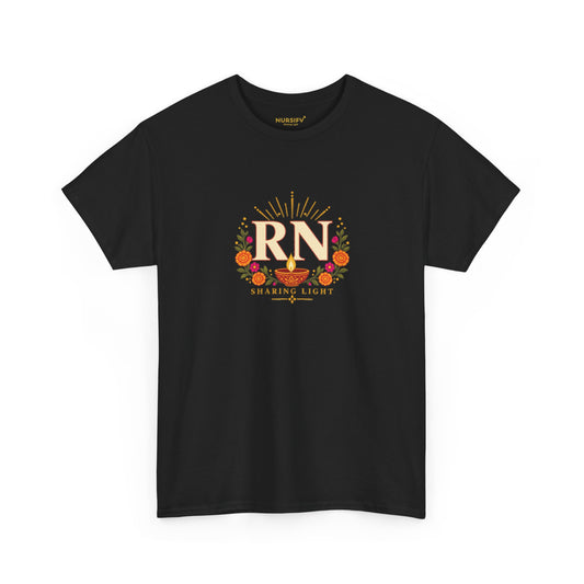 Black Nursify RN Diwali T shirt with ivory RN lettering, a diya lamp, orange and pink flowers, and Sharing Light text on the front.