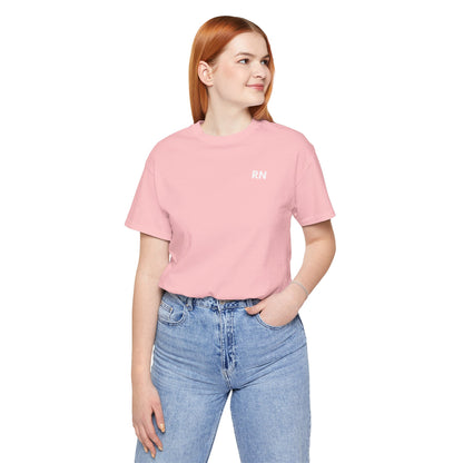 Woman wearing the pink Minimalist RN unisex T-shirt with jeans
