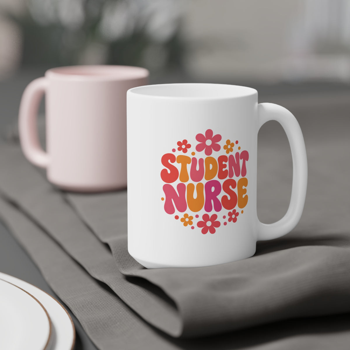 Student Nurse Mug, Coral Floral, 15 oz, styled supplier scene with centred artwork