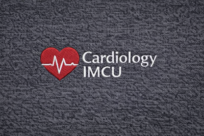 Embroidered Sample Text 'Cardiology IMCU' with a red heart and heartbeat line on a textured dark background