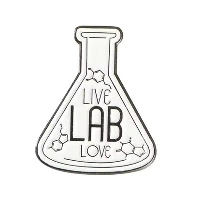 Flask-shaped enamel pin with the words ‘LIVE LAB LOVE’ and molecular structure accents in black and white.