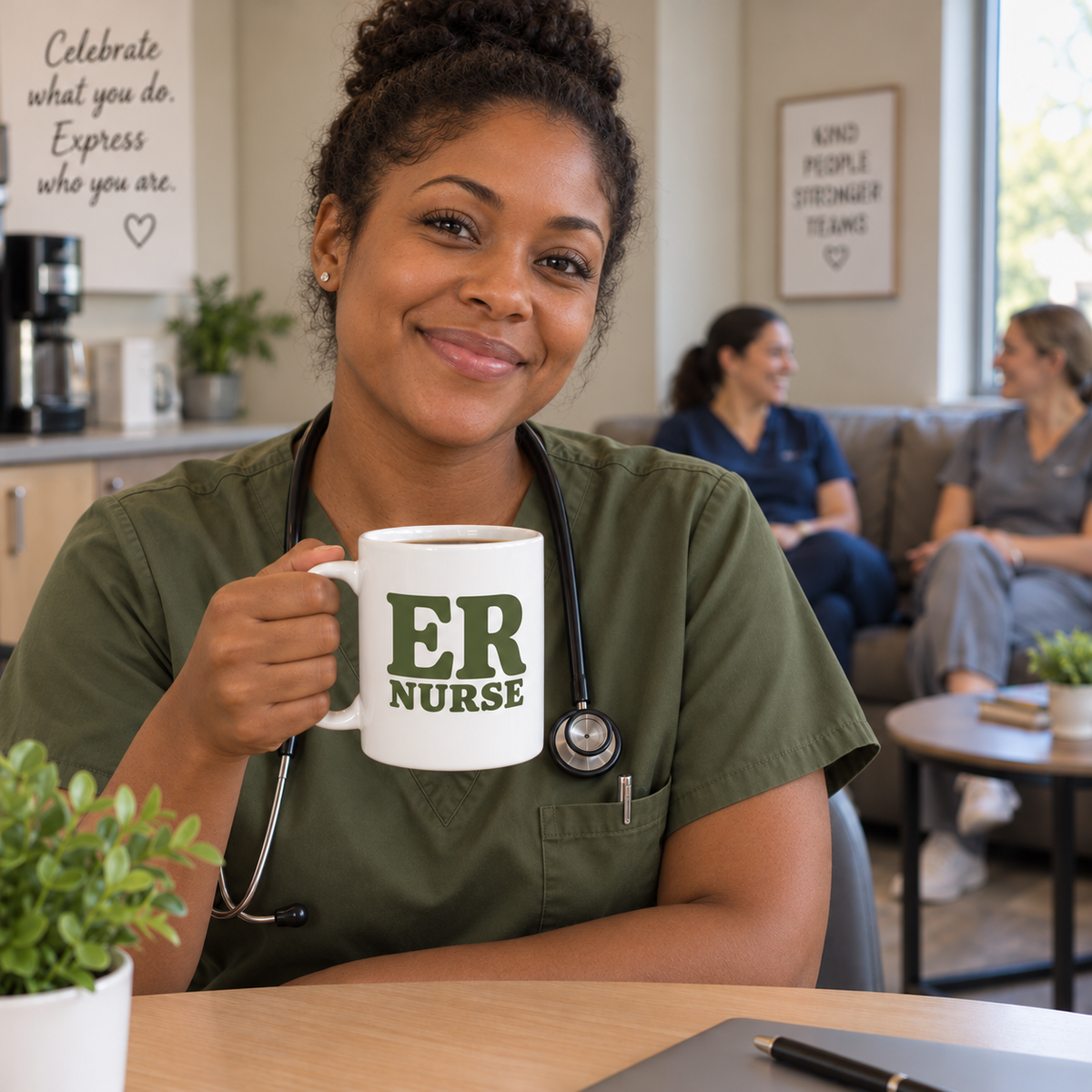 Nurse holding the olive ER nurse mug during a break, with two teammates chatting on a couch behind them.