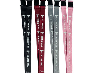 Black, grey, burgundy and pink Nurse double-breakaway lanyards arranged as a gift set