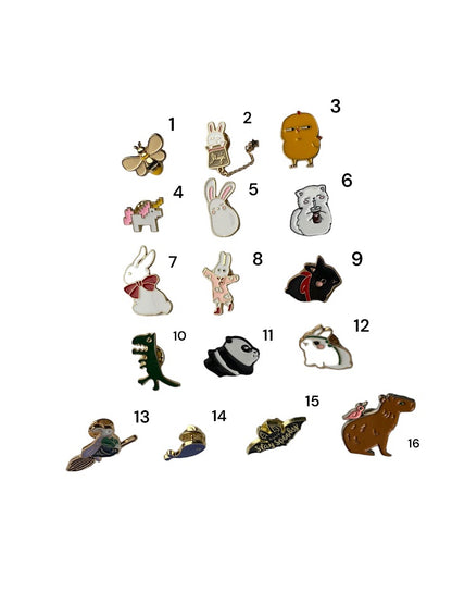 Number each one though sixteen this images shows Assorted small animal and creature enamel pins in different illustrated designs, shown together on a white background to display selection and scale.  