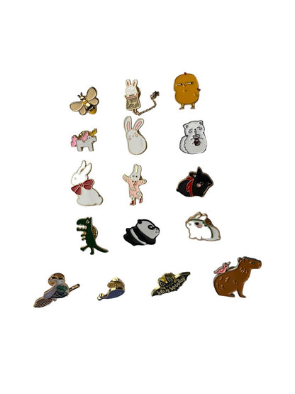
Assorted small animal and creature enamel pins in different illustrated designs, shown together on a white background to display selection and scale.
