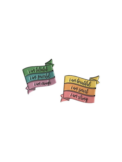 I AM… enamel pins with motivational quotes. Hard enamel with rubber clutch backing. Suitable for jackets, bags, lanyards, or clothing. 