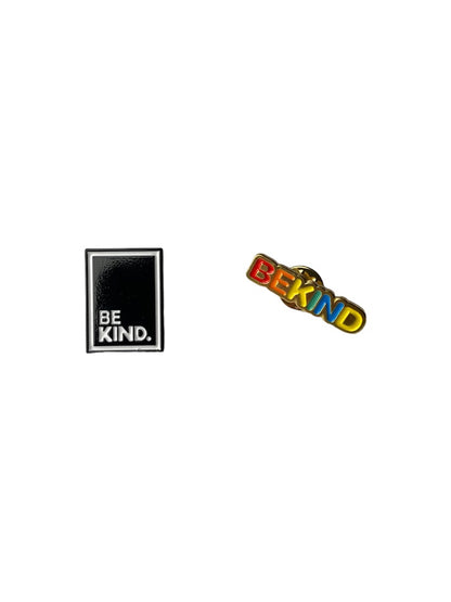 Two pins one being a text saying be kin in rainbowed letters another being a rectagaled with black backround, white outline and be kind in white. 