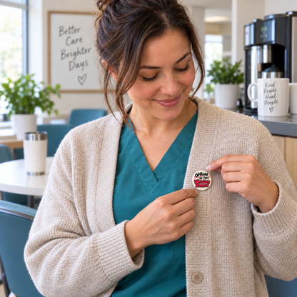 Nurse fastening a small 37 mm Offload to Whiskey Romeo pinback button to her cardigan