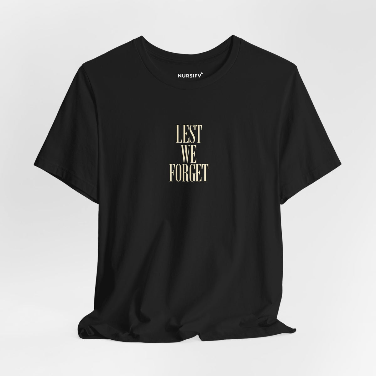 Black Lest We Forget T-shirt on a hanger showing its narrow centre print.