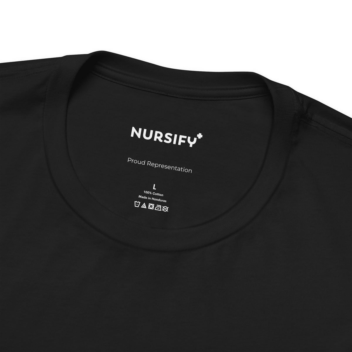 Close-up of the Lest We Forget shirt collar and Nursify Proud Representation neck branding.