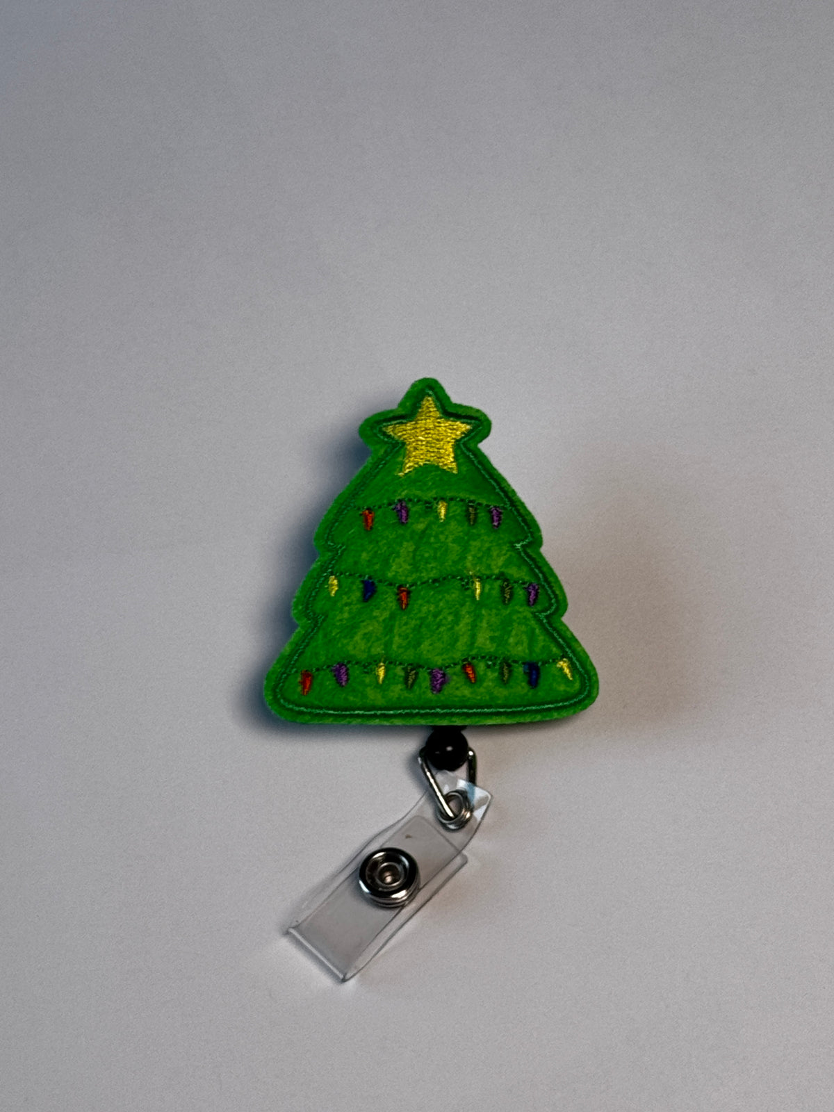 4. Christmas Tree. Actual Christmas Tree Badge Reel front