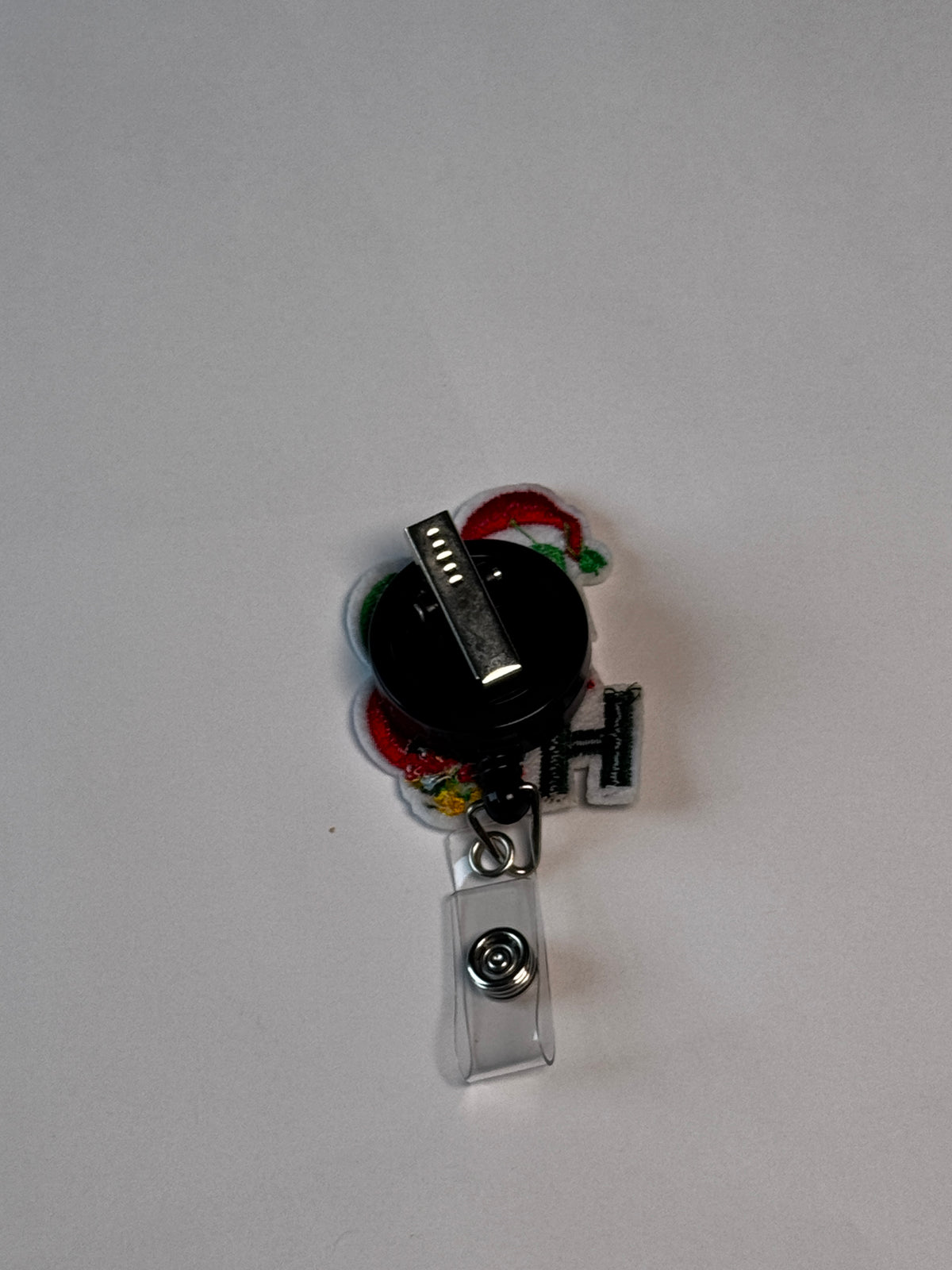 1. Ho Ho Ho. Actual Ho Ho Ho Christmas Badge Reel back
