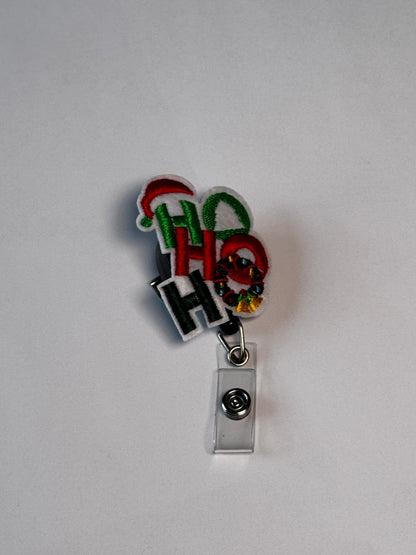 1. Ho Ho Ho. Actual Ho Ho Ho Christmas Badge Reel front