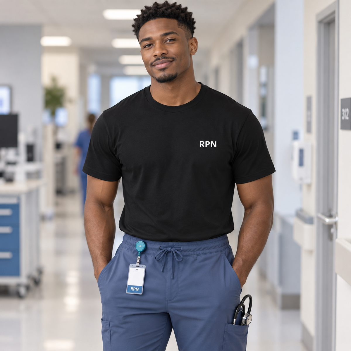 Male nurse wearing a black Nursify RPN short sleeve shirt with blue scrub pants and a teal badge reel.