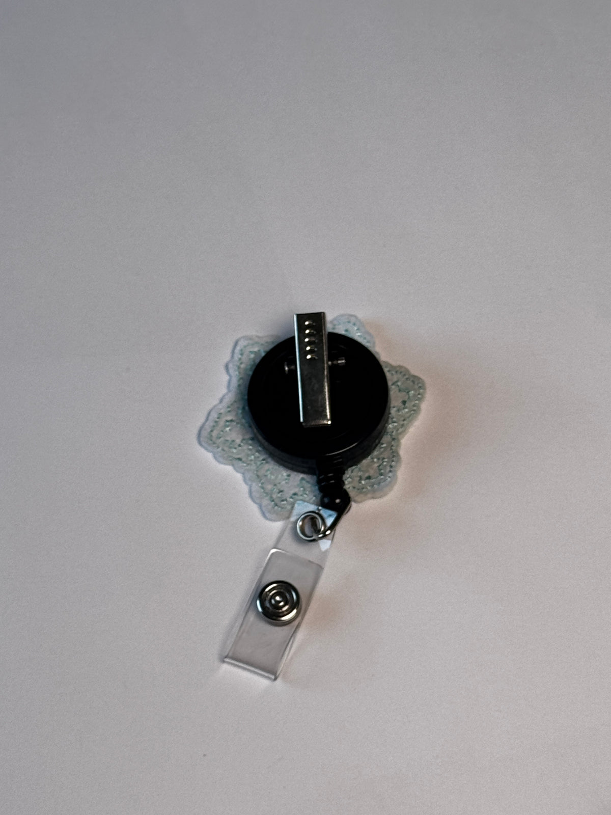9. Smiling Snowflake. Actual Smiling Snowflake Badge Reel back
