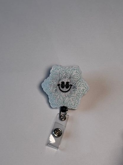 9. Smiling Snowflake. Actual Smiling Snowflake Badge Reel front