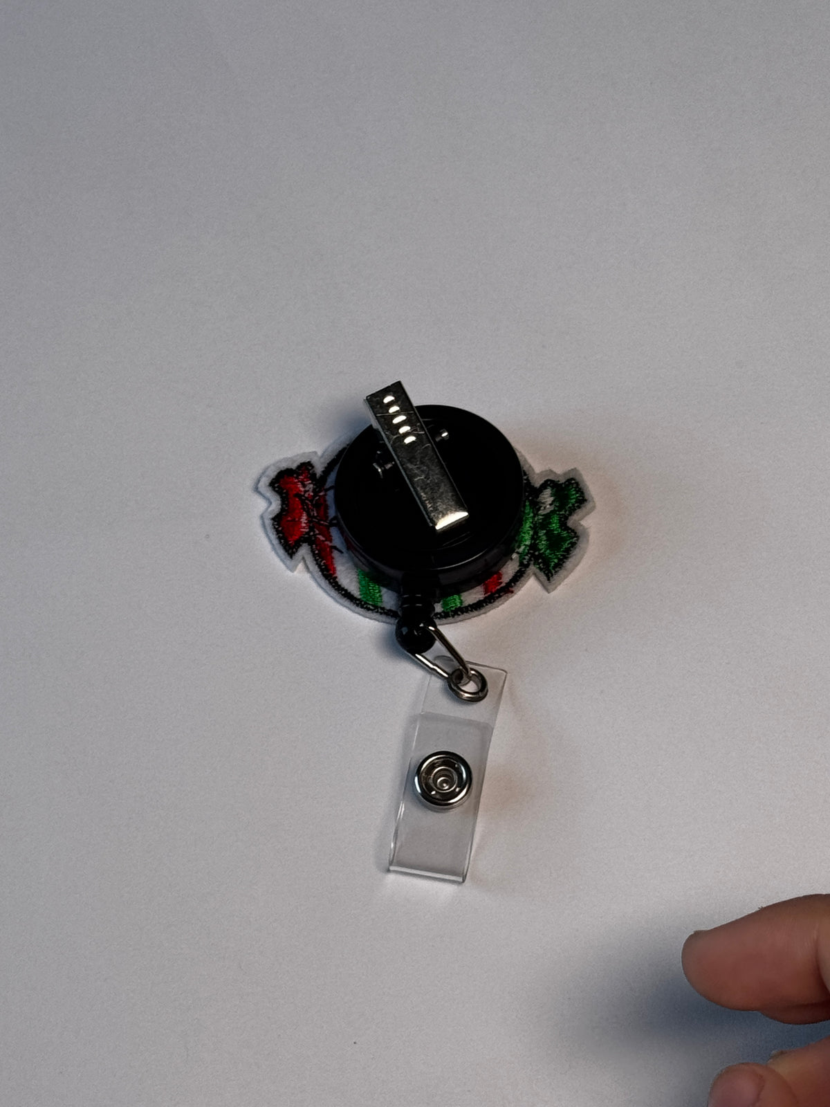 8. Striped Candy. Actual Striped Candy Christmas Badge Reel back