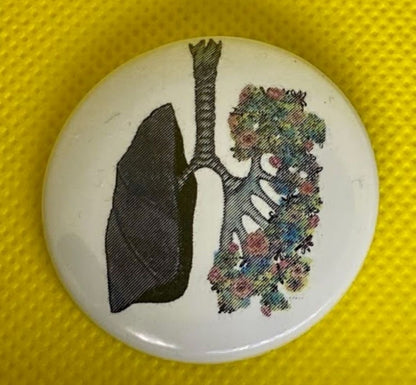Anatomical lung button pin with floral artwork by Emma Greer RN