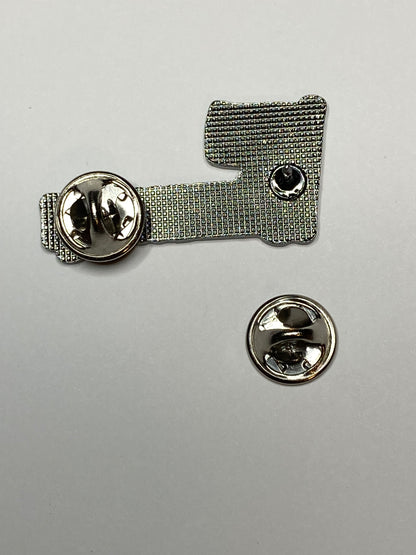 Close view of the textured metal back of the Filipino RN enamel pin