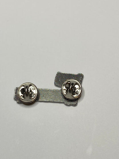 Side view of Filipino RN enamel pin showing its metal construction