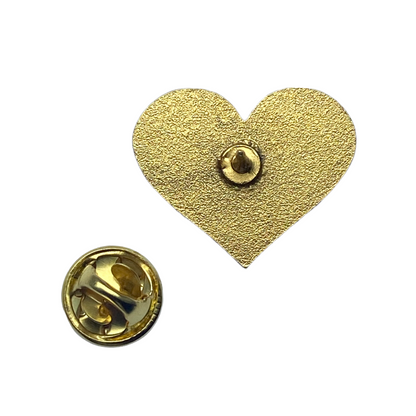 Gold-tone back and removable closure of the Inclusion heart enamel pin
